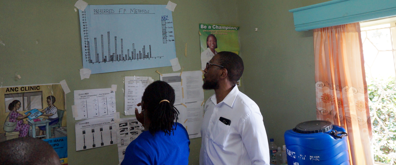 Dr. Ernest Nyamato with health center administer Zena Anindo inside the maternity ward where patients discuss family planning and CAC services. 