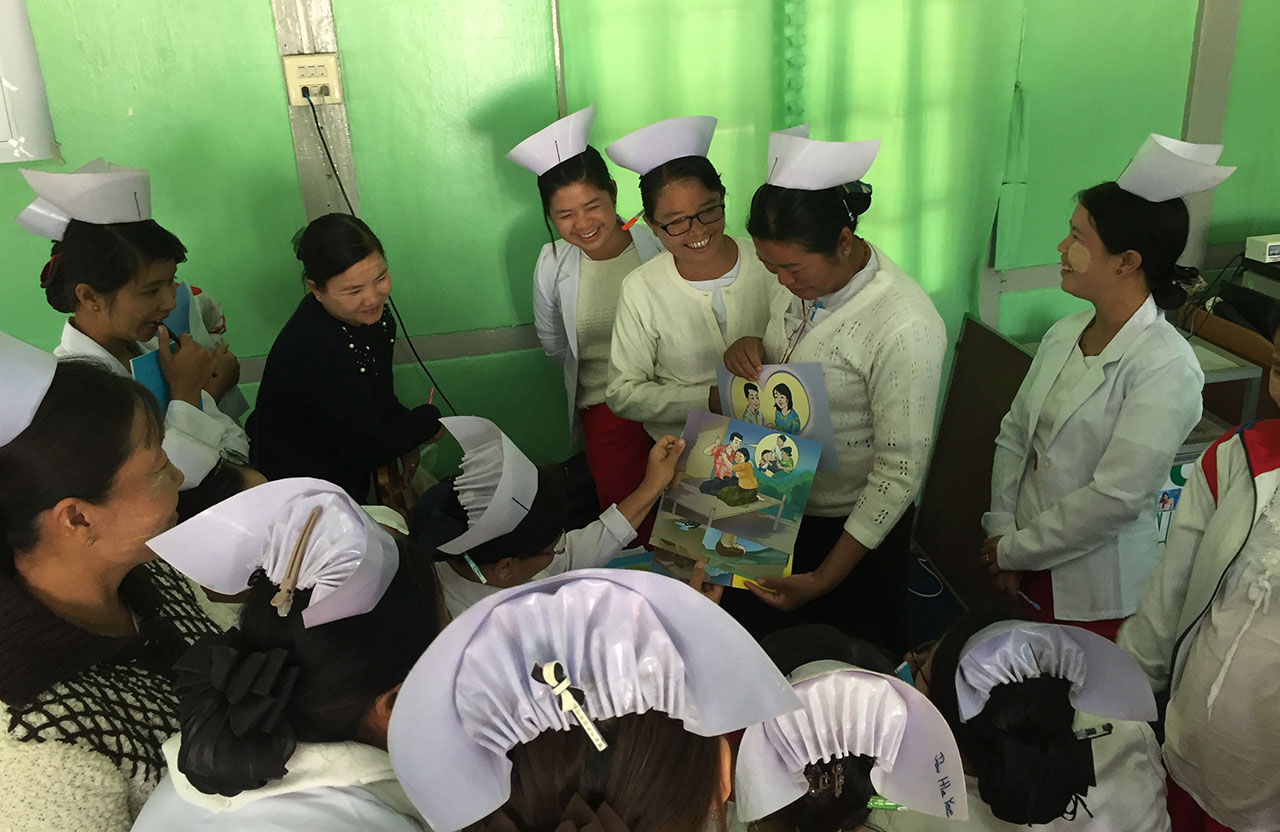 Midwives and Lady Health Visitors practice using IEC materials in Pinlaung, Myanmar.