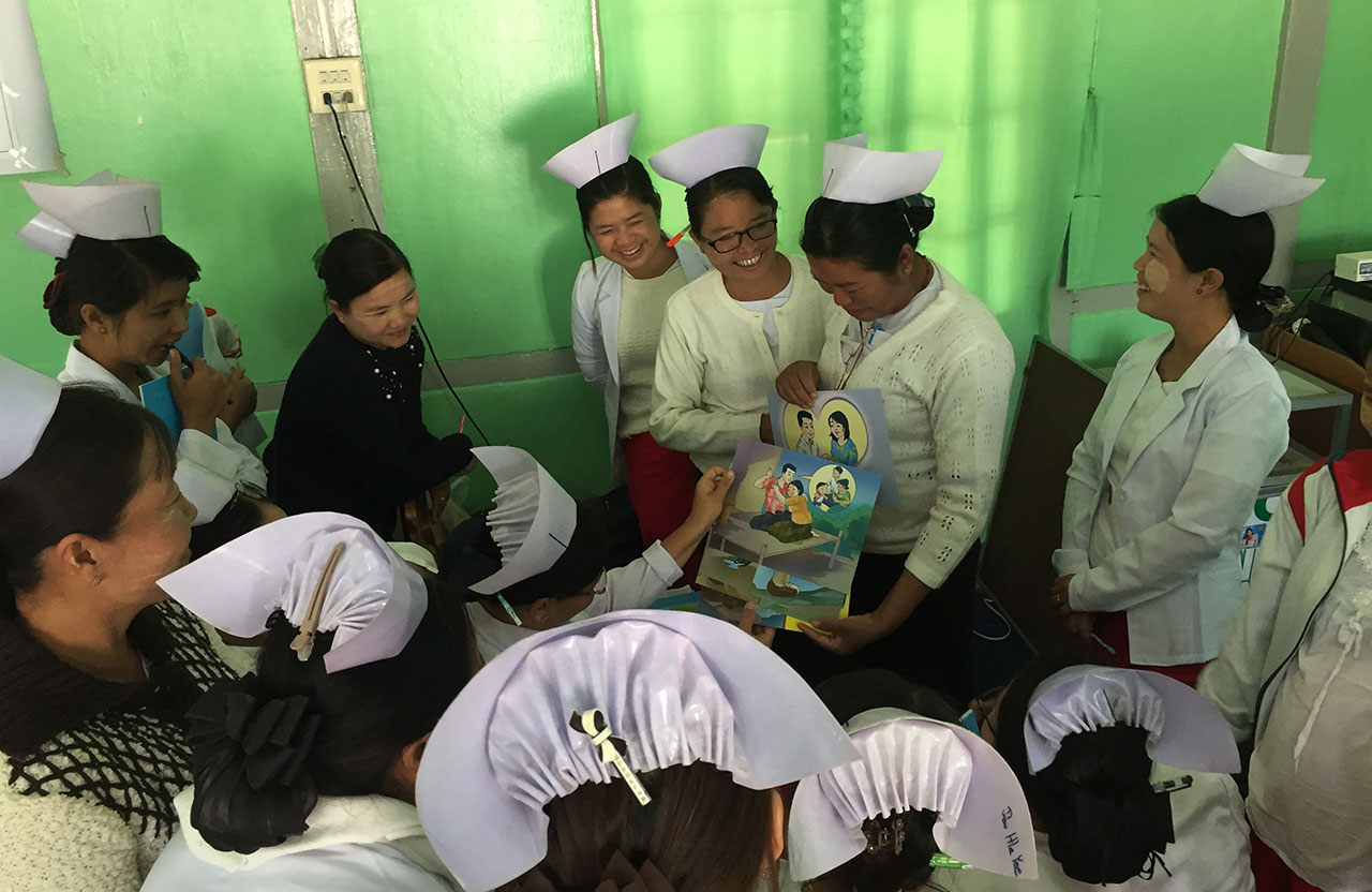 Midwives and Lady Health Visitors practice using IEC materials in Pinlaung, Myanmar. Midwives and Lady Health Visitors practice using IEC materials in Pinlaung, Myanmar.