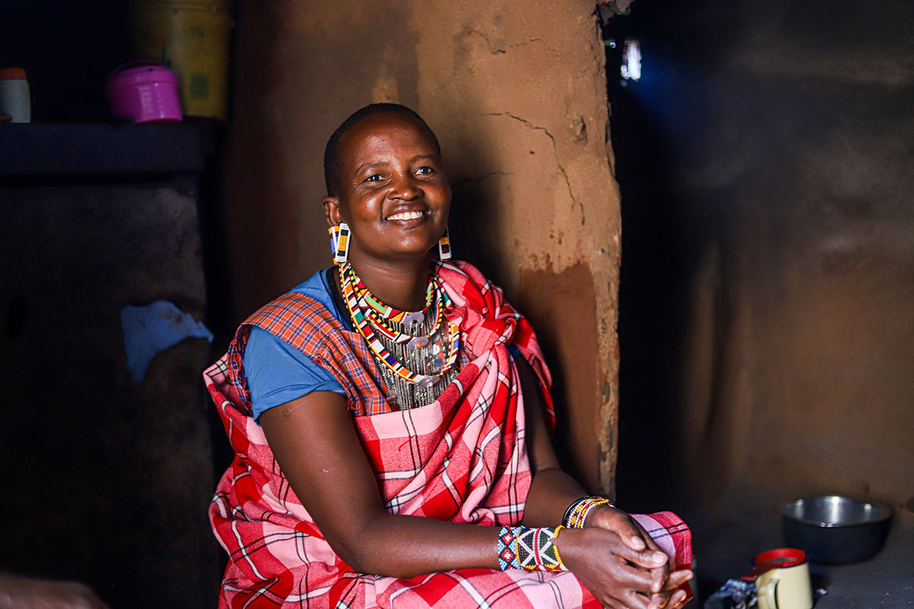 Normejooli Munka a community member who lives near the water source uses the water for cooking and cleaning in her kitchen.