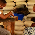 Health worker giving aid supplies to a woman