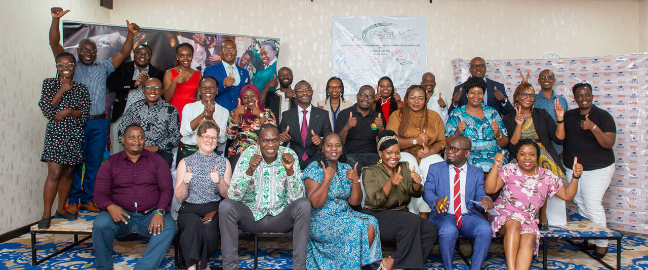 Members of the ESAParC in a group photo smiling giving a thumbs up