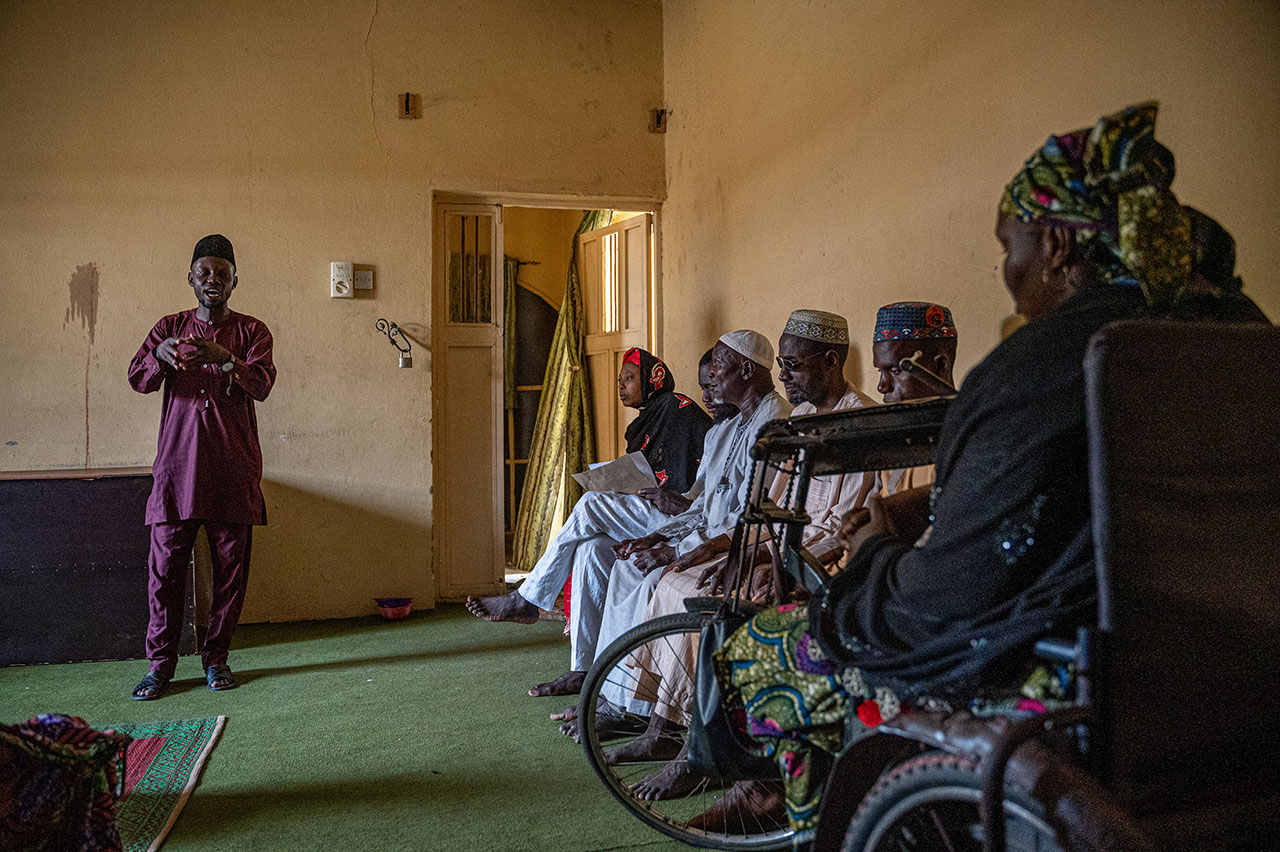 Kabiru Muhammed leads a community dialogue