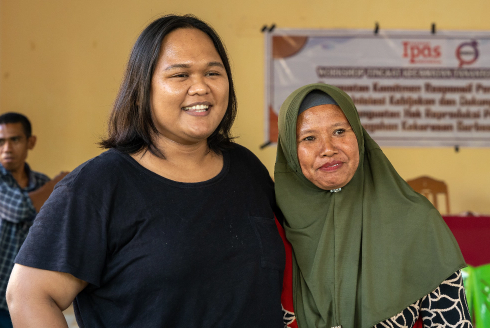 Two women smiling at the camera