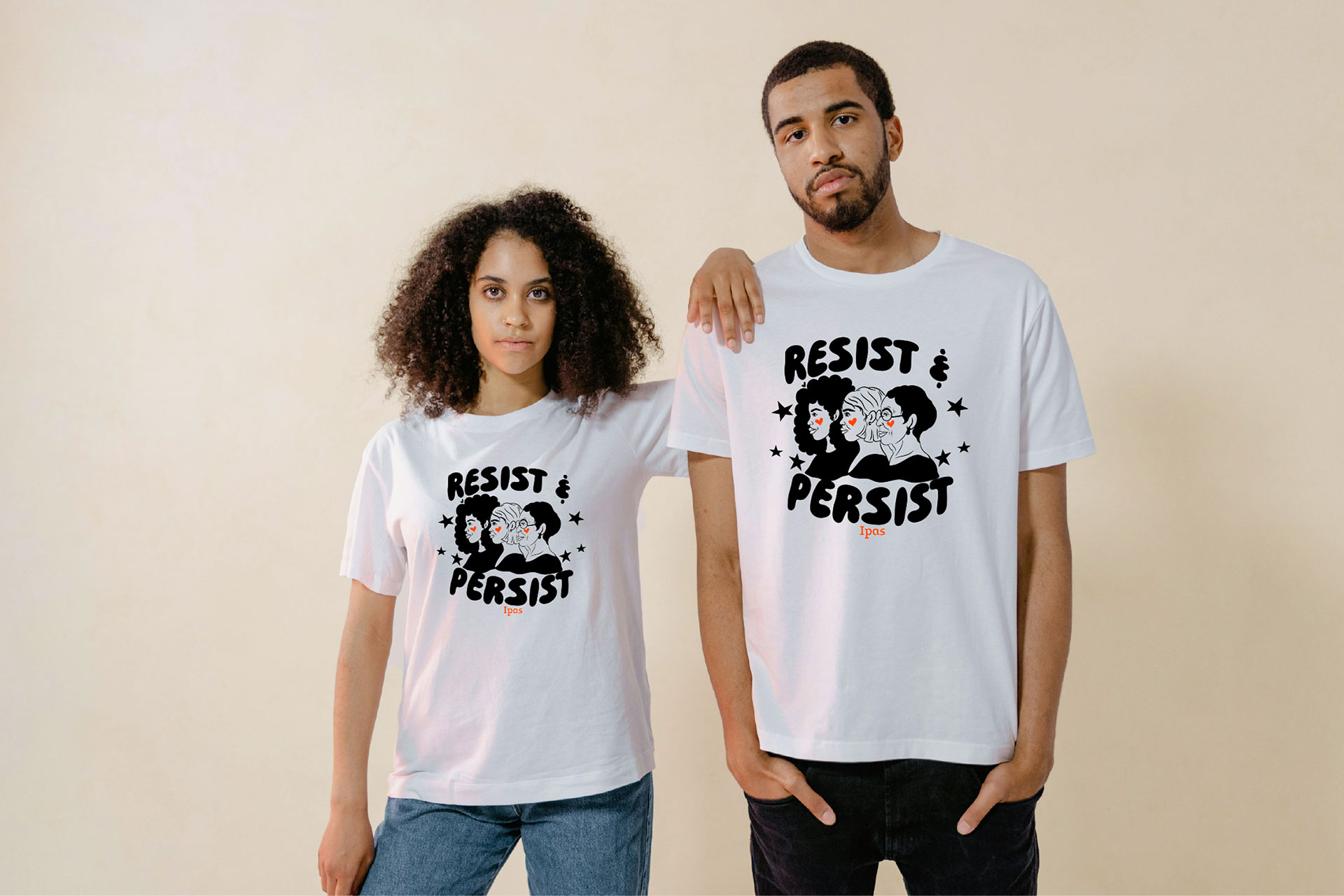 Resist and Persist merch by Devon Blow Two people stand against a beige background, wearing matching white t-shirts with a "RESIST & PERSIST" design featuring an illustration of a person and stars. The person on the left has curly hair, and the person on the right has short hair.