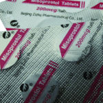 Silver blister packs labeled "Misoprostol Tablets 200 mcg" with pink and black text; some tablets have been removed from the packaging, commonly used for abortion with pills in Kinshasa.