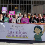 A group of women hold signs and a banner reading "Las niñas son niñas," protesting child marriage outside a building. Their advocacy calls for girls’ rights and a ban on child marriage, demanding an end to forced unions for young girls.